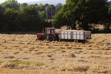 Image showing Tractor with a trailer full of grain