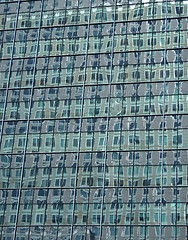 Image showing Green reflections in the windows of a skyscraper