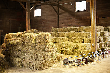 Image showing Interior of barn with hay bales