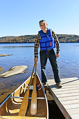 Image showing Man with canoe