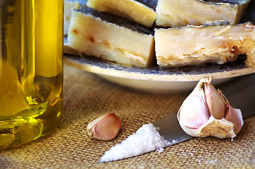 Image showing Codfish, olive oil and garlic. 