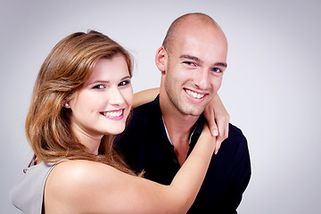 Image showing young attractive couple in love embracing portrait