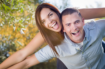 Image showing Mixed Race Romantic Couple Portrait in the Park