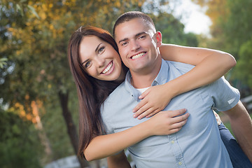 Image showing Mixed Race Romantic Couple Portrait in the Park