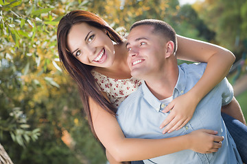 Image showing Mixed Race Romantic Couple Portrait in the Park