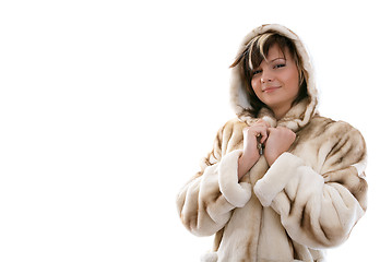 Image showing Girl in fur coat on white background