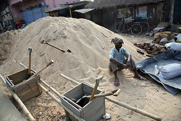 Image showing Man working on construction of new road in Kumrokhali, West Bengal, India