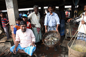 Image showing Selling a fish on fish market in Kumrokhali, West Bengal, India