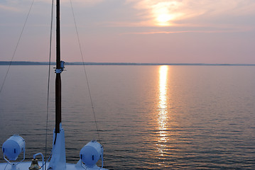 Image showing Summer sunset seen from the prow of a cruise liner