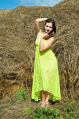 Image showing Young beautiful woman on hay