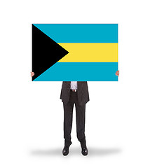 Image showing Businessman holding a big card, flag of the Bahamas