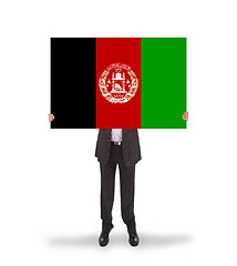 Image showing Businessman holding a big card, flag of Afghanistan