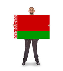 Image showing Businessman holding a big card, flag of Belarus