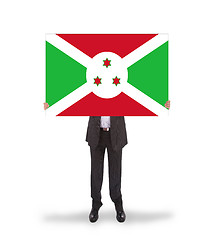 Image showing Businessman holding a big card, flag of Burundi