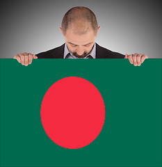 Image showing Businessman holding a big card, flag of Bangladesh