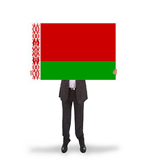 Image showing Businessman holding a big card, flag of Belarus