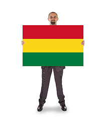 Image showing Businessman holding a big card, flag of Bolivia