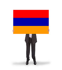 Image showing Businessman holding a big card, flag of Armenia