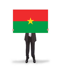 Image showing Businessman holding a big card, flag of Burkina Faso