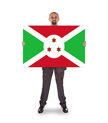 Image showing Businessman holding a big card, flag of Burundi