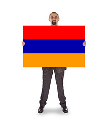 Image showing Businessman holding a big card, flag of Armenia