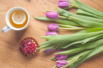 Image showing Violet tulips on the wood