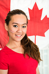 Image showing Sportswoman Standing Against Canadian Flag