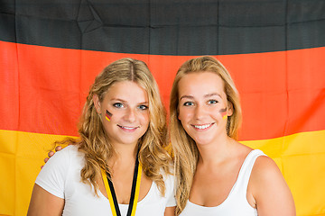 Image showing Sportswomen Standing Against German Flag