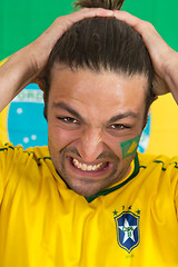 Image showing Brazilian sports fan in dispair