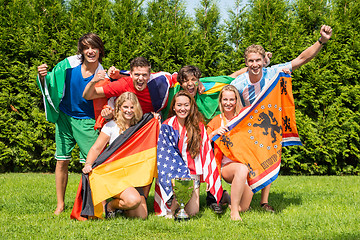 Image showing International Athletes With Various National Flags Celebrating I
