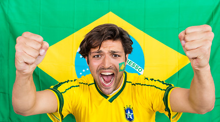 Image showing Successful Sportsman Shouting Against Brazilian Flag