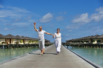 Image showing happy young couple have fun on beach