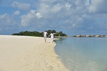 Image showing happy young couple have fun on beach