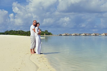 Image showing happy young couple have fun on beach