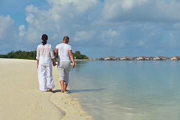 Image showing happy young couple have fun on beach