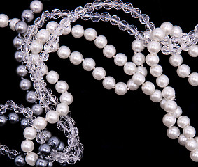 Image showing White, black and grey pearls on the black silk 