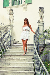 Image showing Beautiful woman stepping down stair