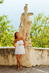 Image showing Woman and statue of warrior