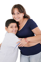 Image showing Happy young mother and her son posing together. Isolated over wh