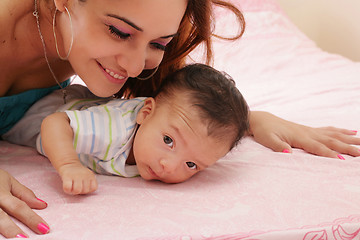 Image showing hispanic mother and her newborn baby