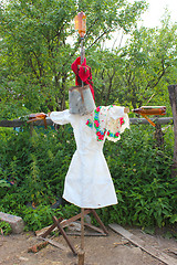 Image showing motley scarecrow in white docktor's smock