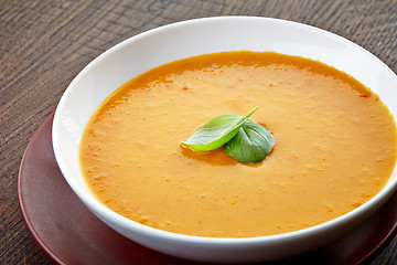 Image showing squash soup with basil leaf