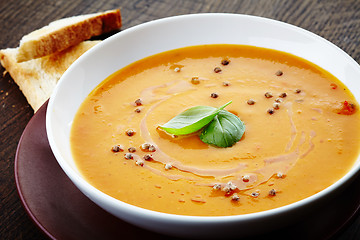 Image showing squash soup with basil leaf