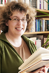 Image showing Beautiful womanl holding a book