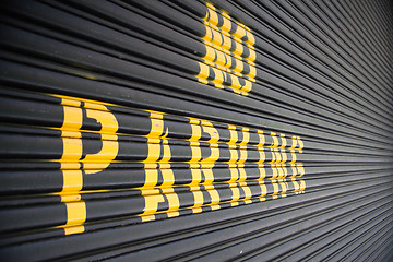 Image showing No parking - yellow sign on the garage