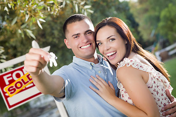 Image showing Military Couple with House Keys and Sold Real Estate Sign