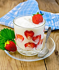Image showing Yogurt thick with strawberries on a board