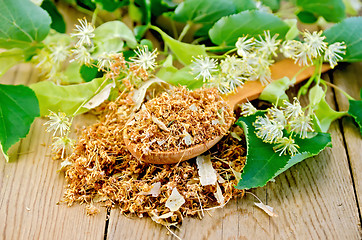 Image showing Herbal tea from dry linden flowers on a spoon