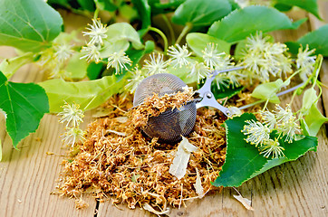 Image showing Herbal tea from dry linden flowers in a tea strainer