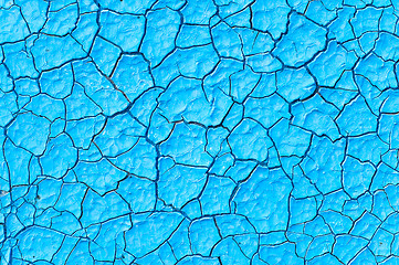 Image showing cracked blue paint surface as grunge background